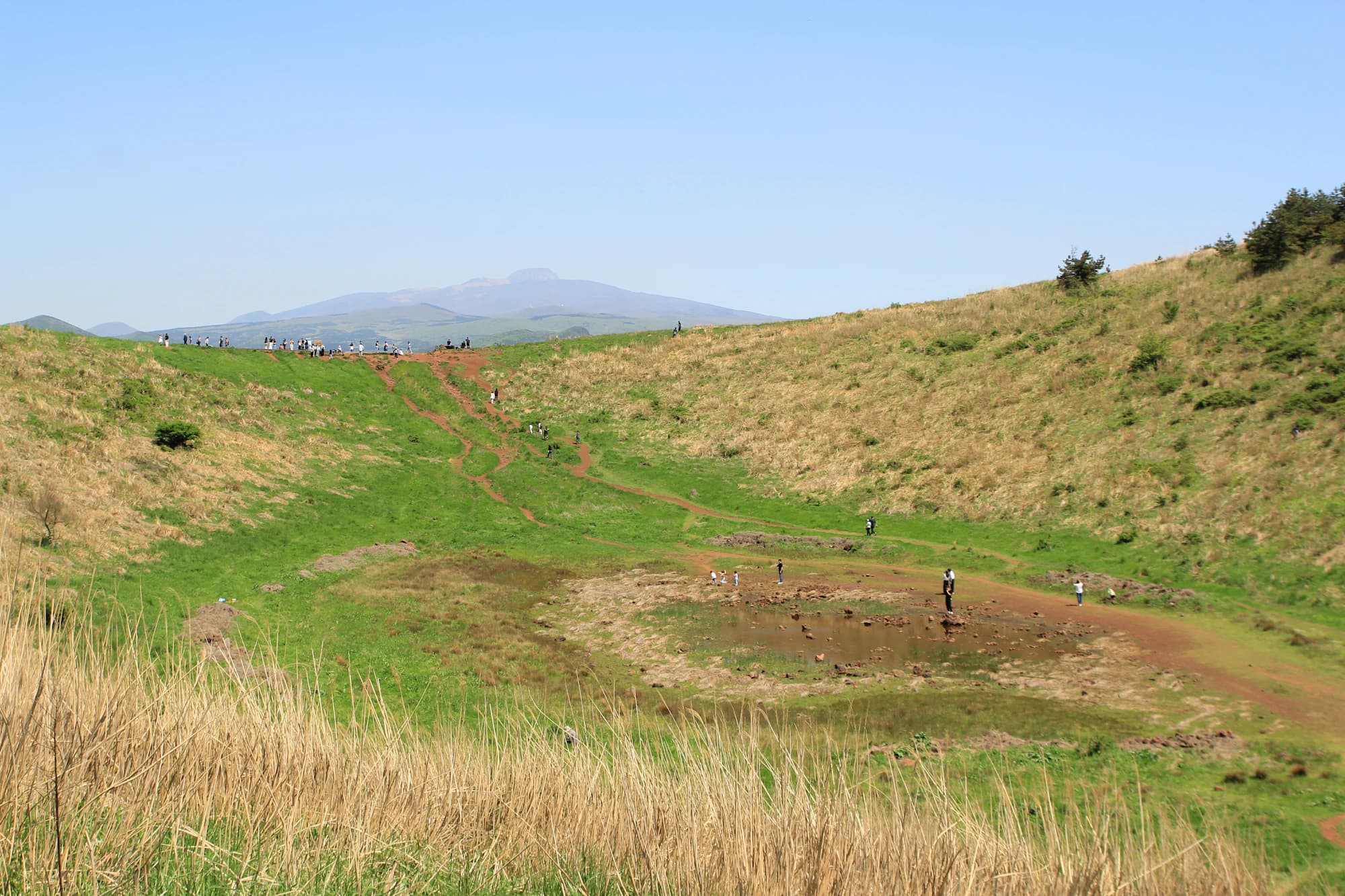 Sangumburi-style oreum crater with green grasslands