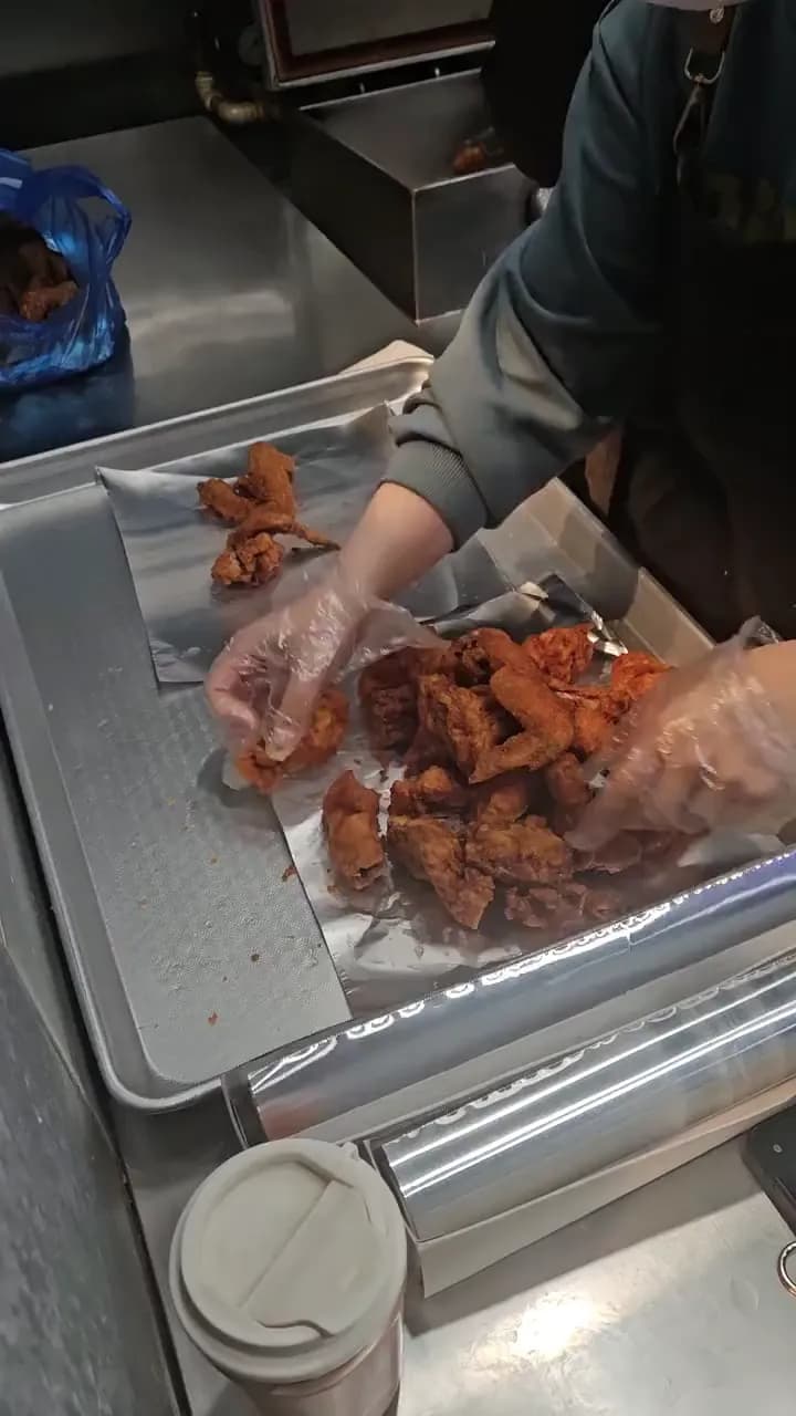 Plating fresh Korean fried chicken
