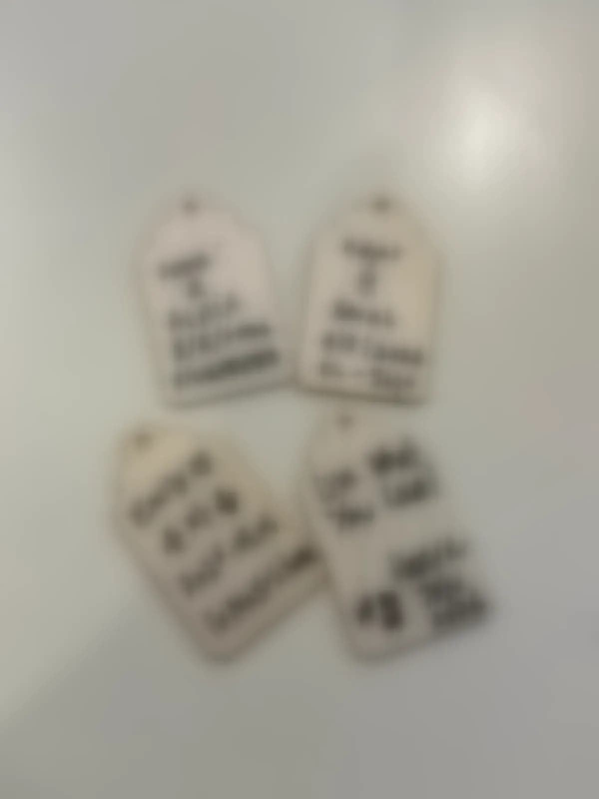 Handwritten blessing tags from the cohort — names blurred for privacy