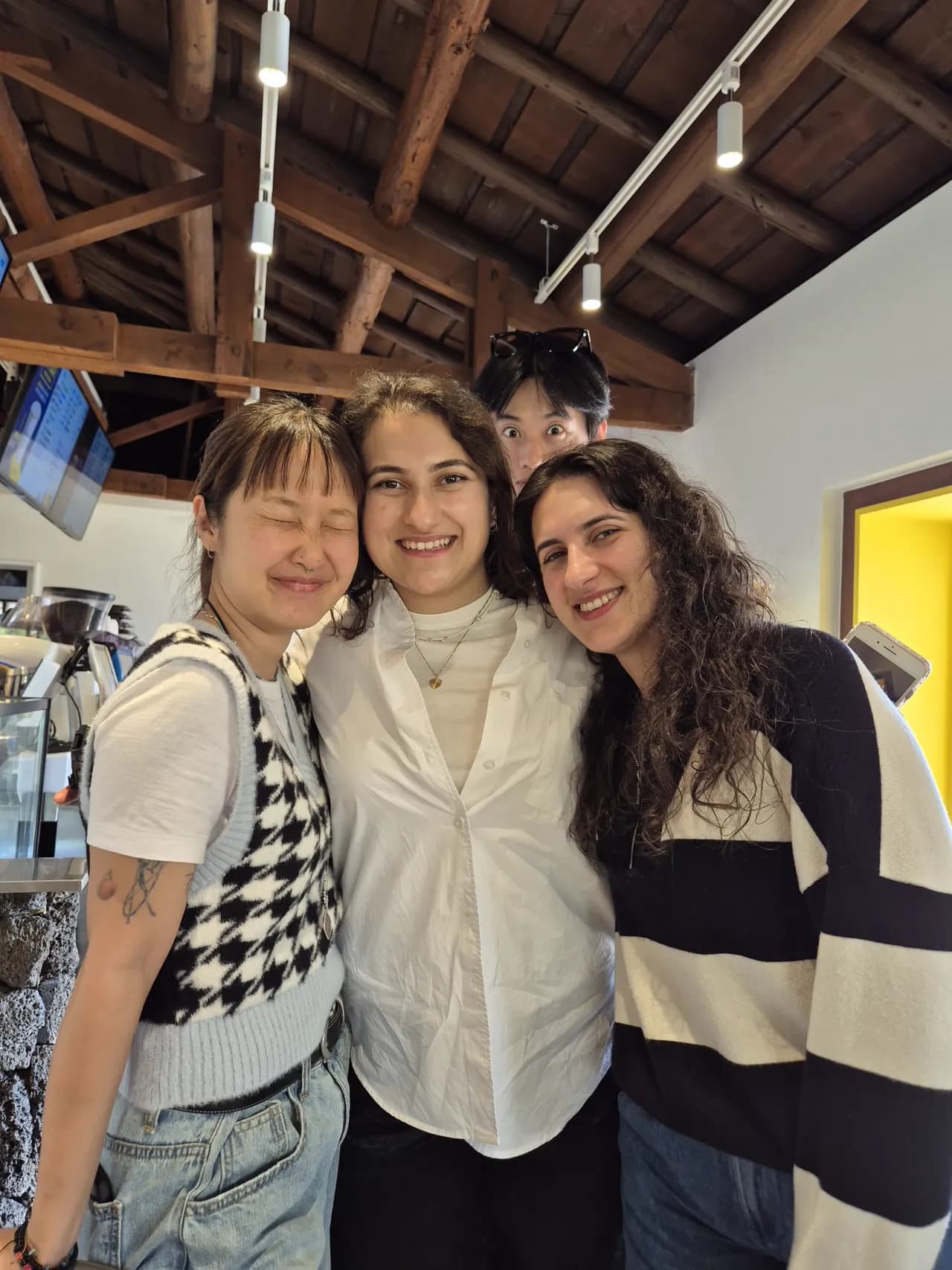 Three guests smiling together at the retreat villa